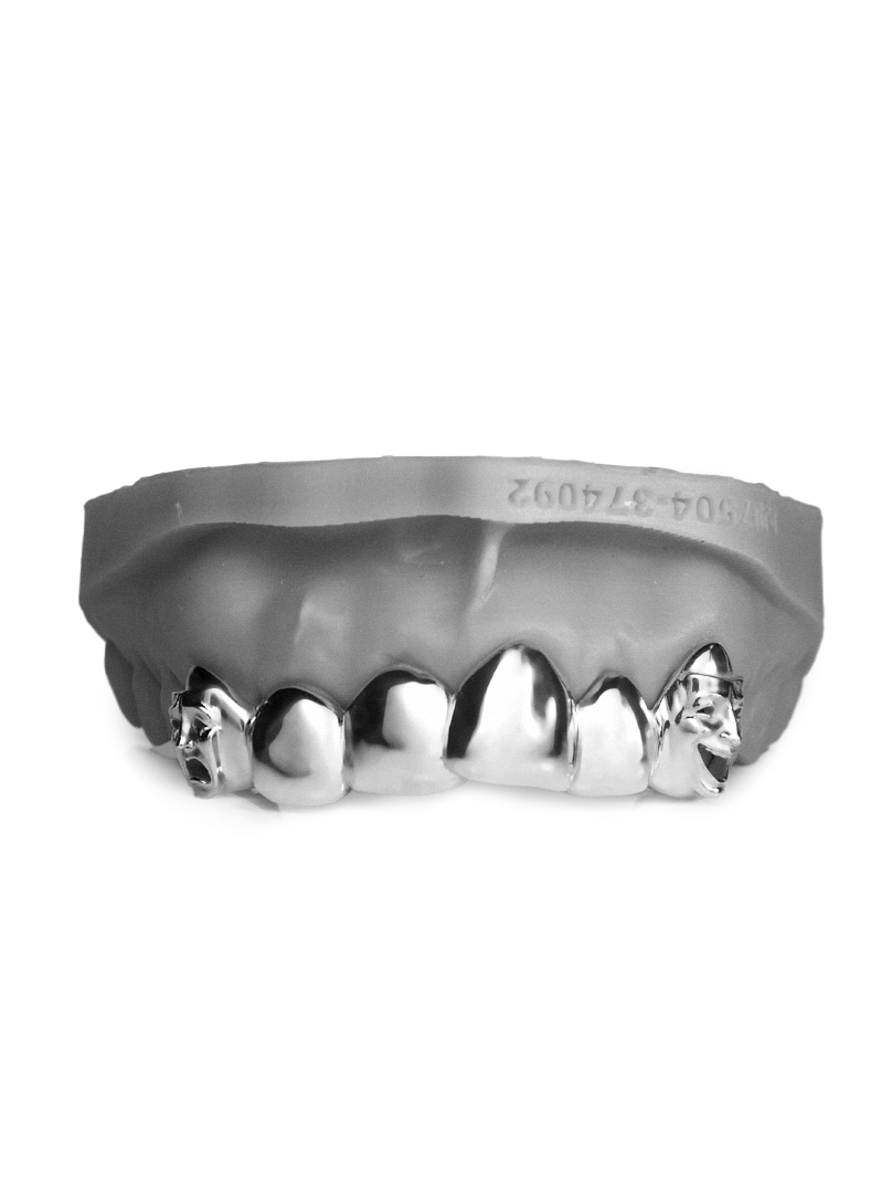 Six piece high-polish grillz with hand-sculpted mask faces carved into both canine caps