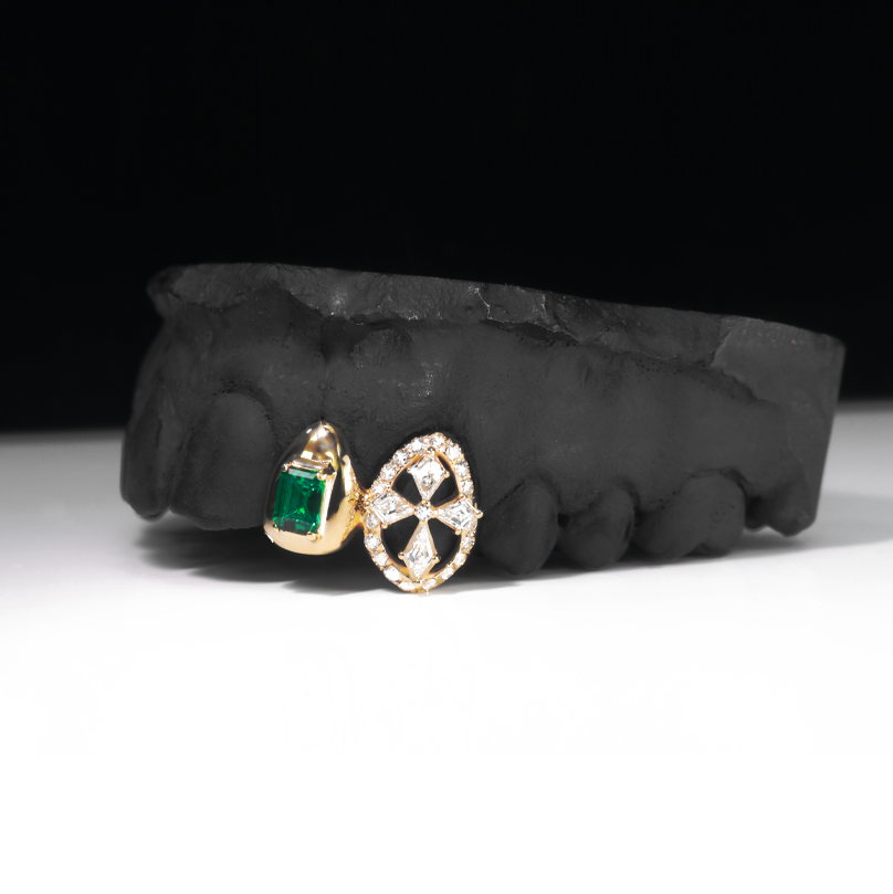 Gold grillz with emerald cut emerald and diamond cross, full view