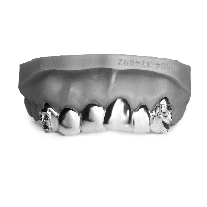 Six piece high-polish grillz with hand-sculpted mask faces carved into both canine caps
