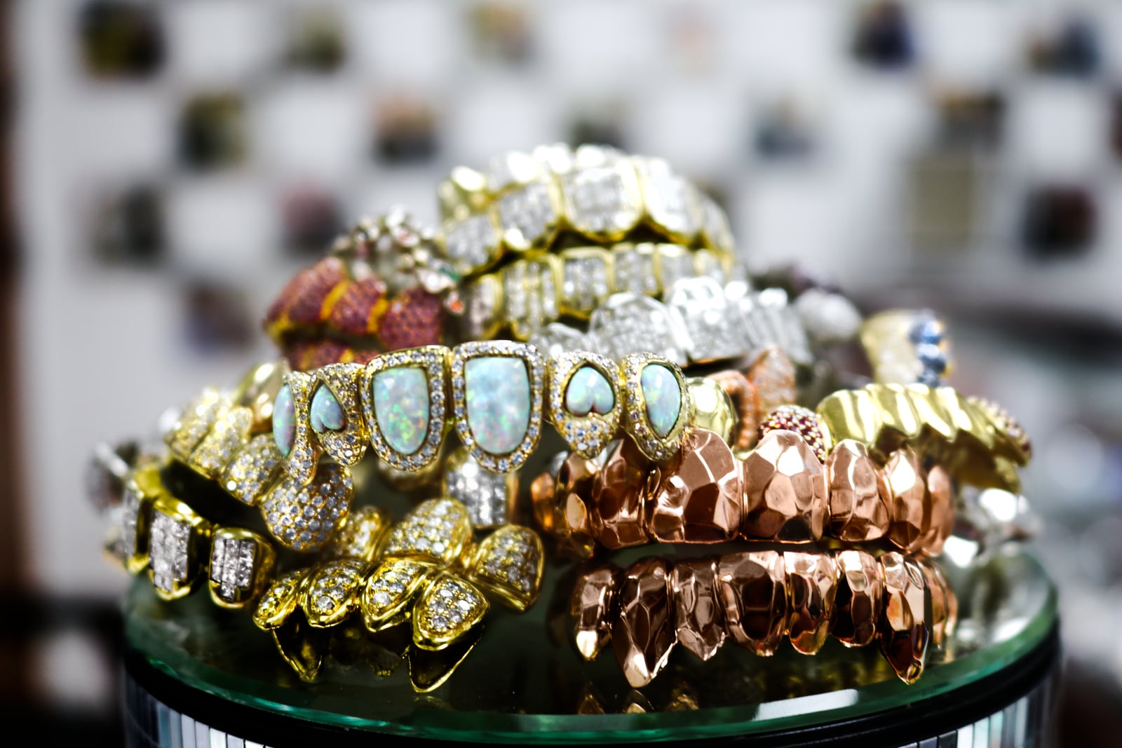 A stack of real GTU grillz - iced, opal, gold and rose gold